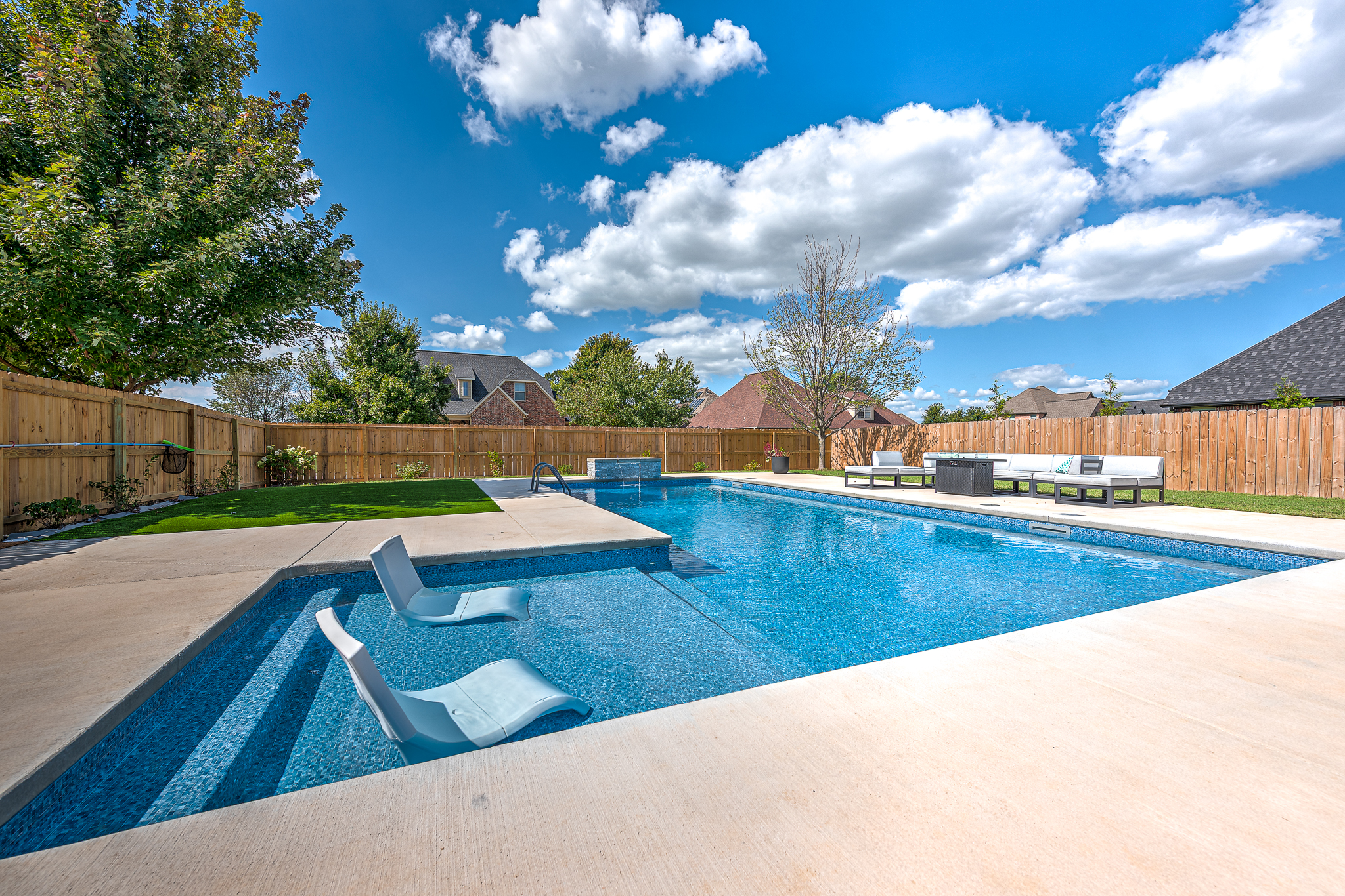 Custom inground pool with freeform shape and coping detail - Northwest Arkansas
