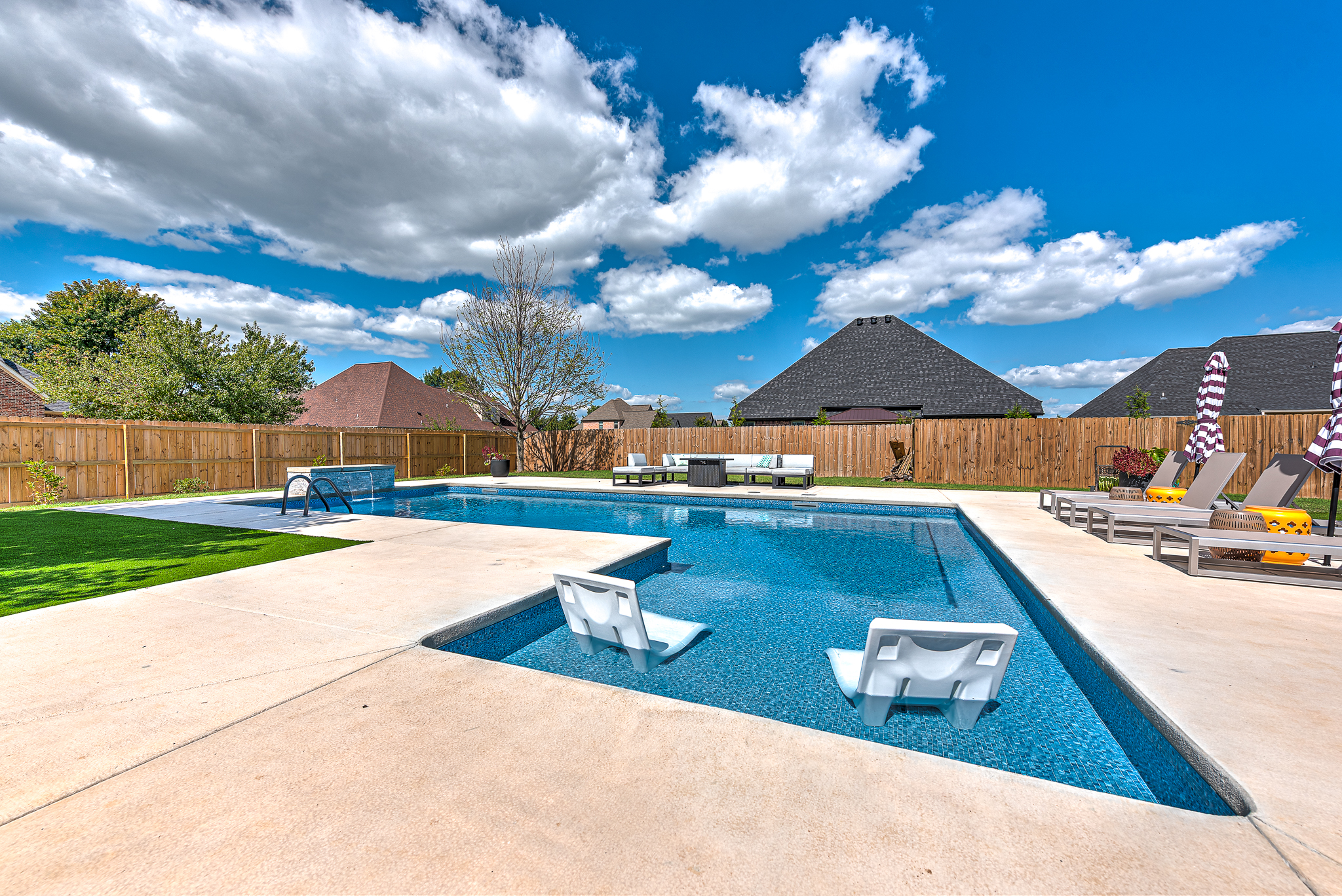 Completed custom pool with premium tile and waterline tile detail - Rogers AR