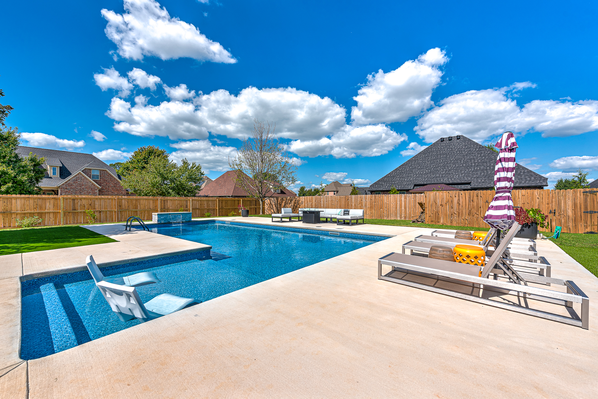 Premium coping and tile finish on custom shotcrete pool - Northwest Arkansas