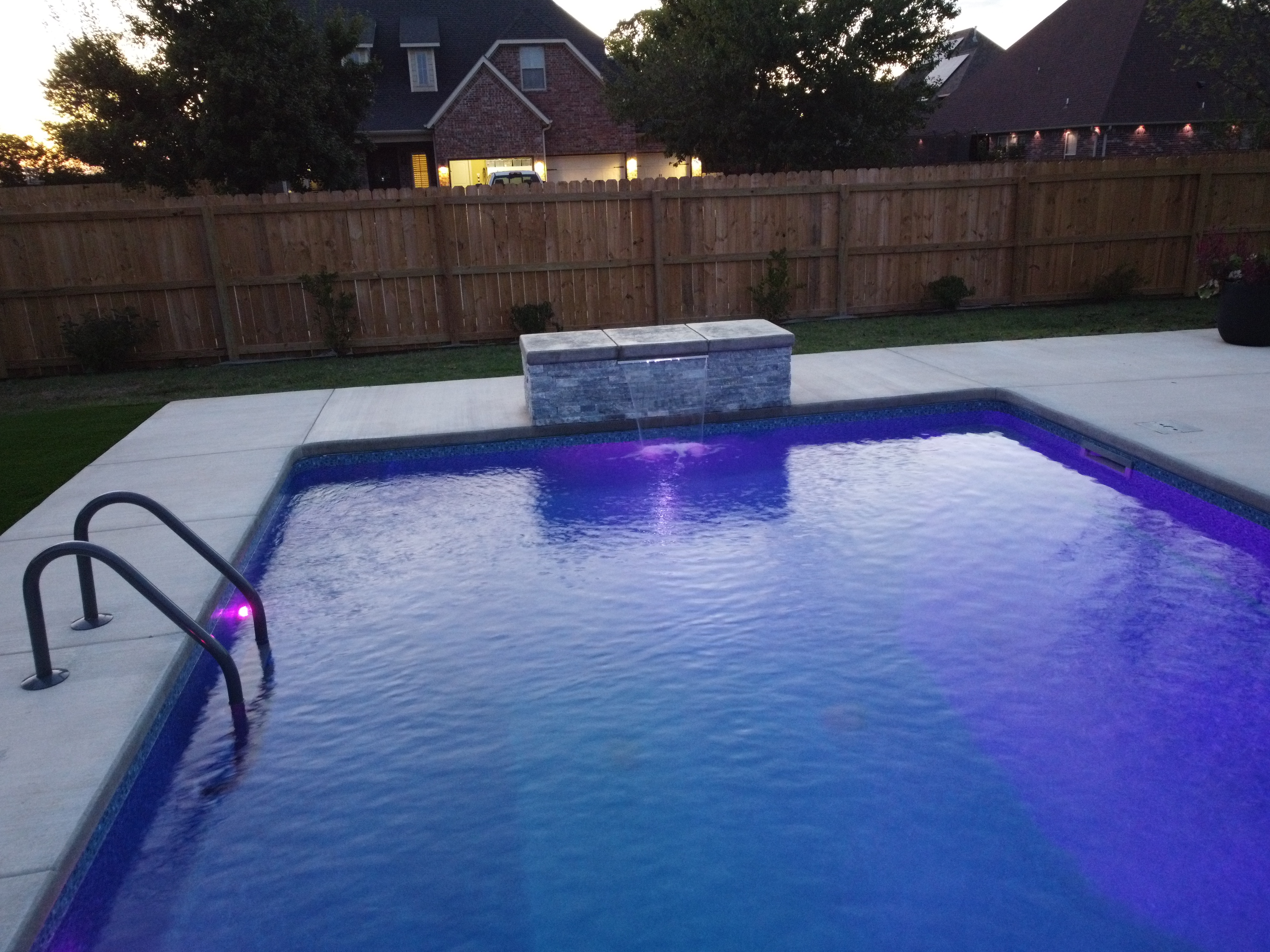 Aerial drone view of custom inground pool construction - Northwest Arkansas