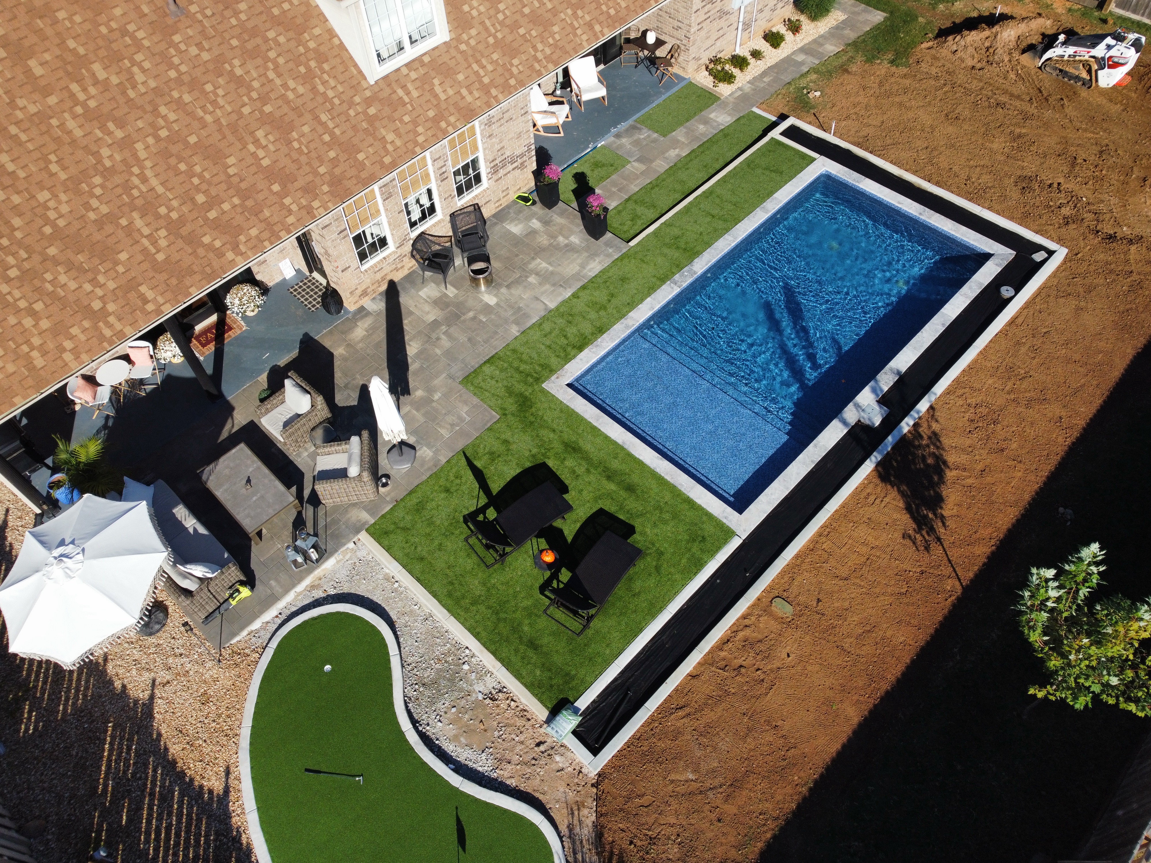 Custom pool with natural stone coping and freeform design - NWA