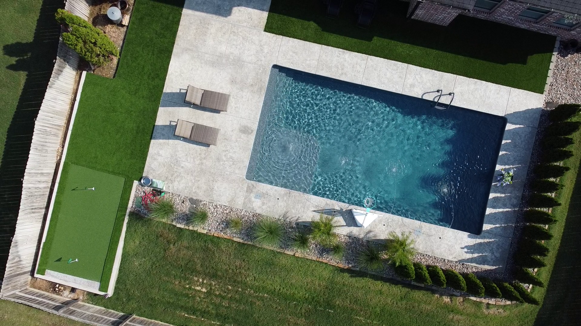 Resort style custom pool with waterfall and tanning shelf - Rogers Arkansas